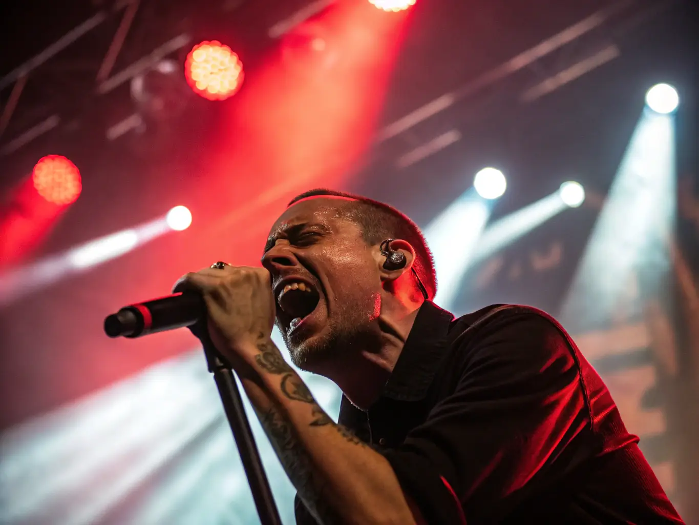 A vibrant image showcasing a musician performing live at a HOLD INSIDE event, with a focus on the energy and connection between the artist and the audience.